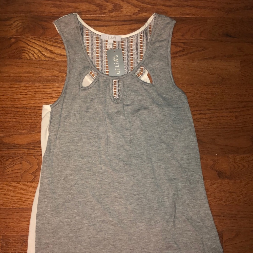Grey and white flowy tank.